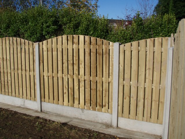 Arched Hit & Miss Panels in Concrete Posts and with Gravel Board and Concrete Strip